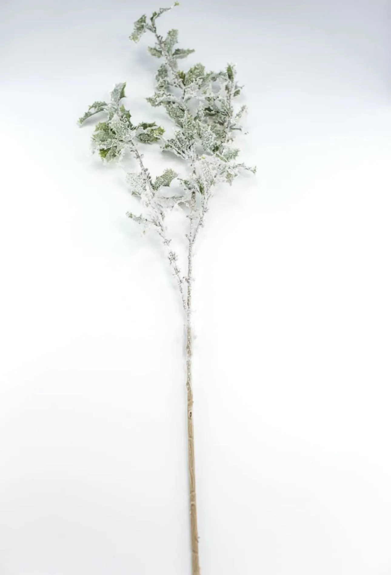 Artificial, snowy, holly greenery spray
